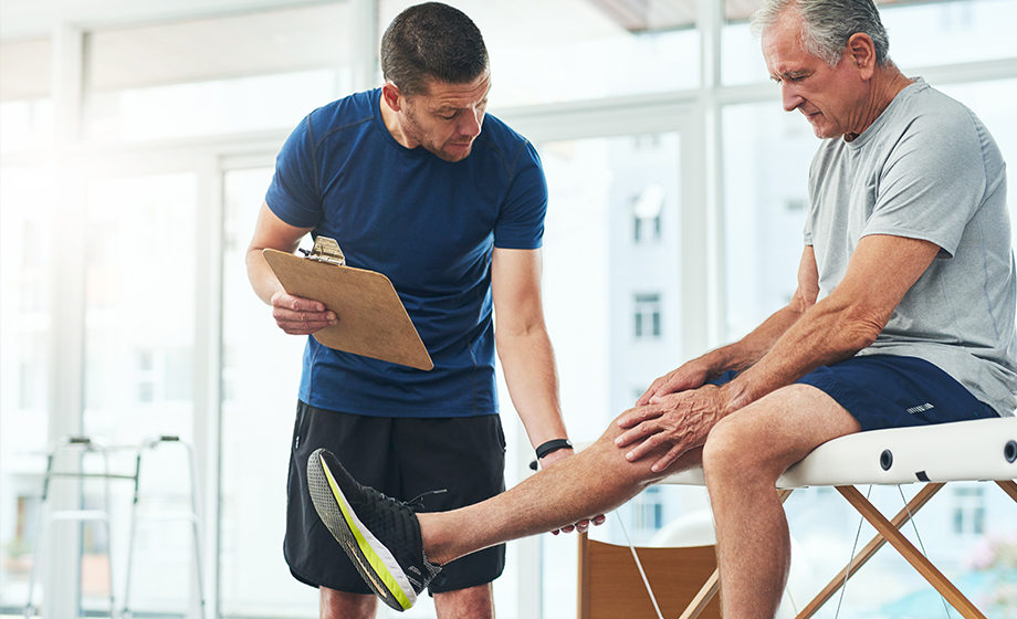 patient performing physical therapy with therapist